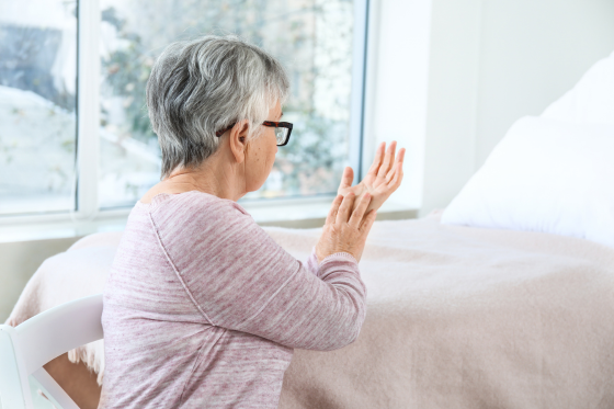 A woman suffers freezing in her hand because of Parkinson's Disease